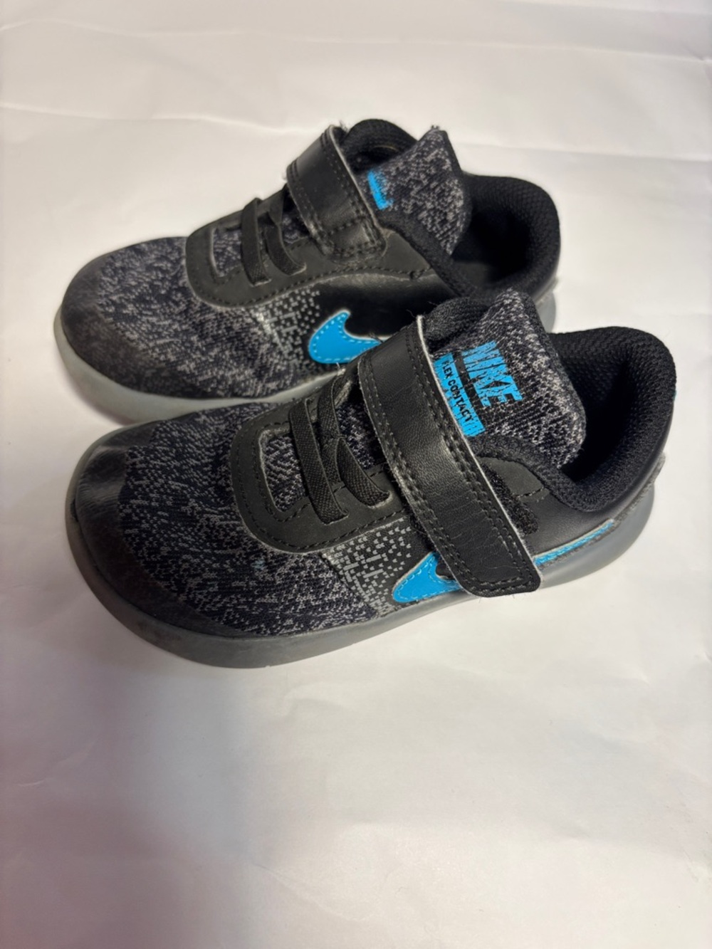 Nike Kids Black Sneakers with Blue Swoosh
